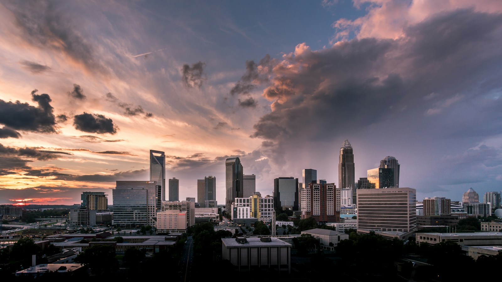 Charlotte skyline at dusk with pink and purple clouds