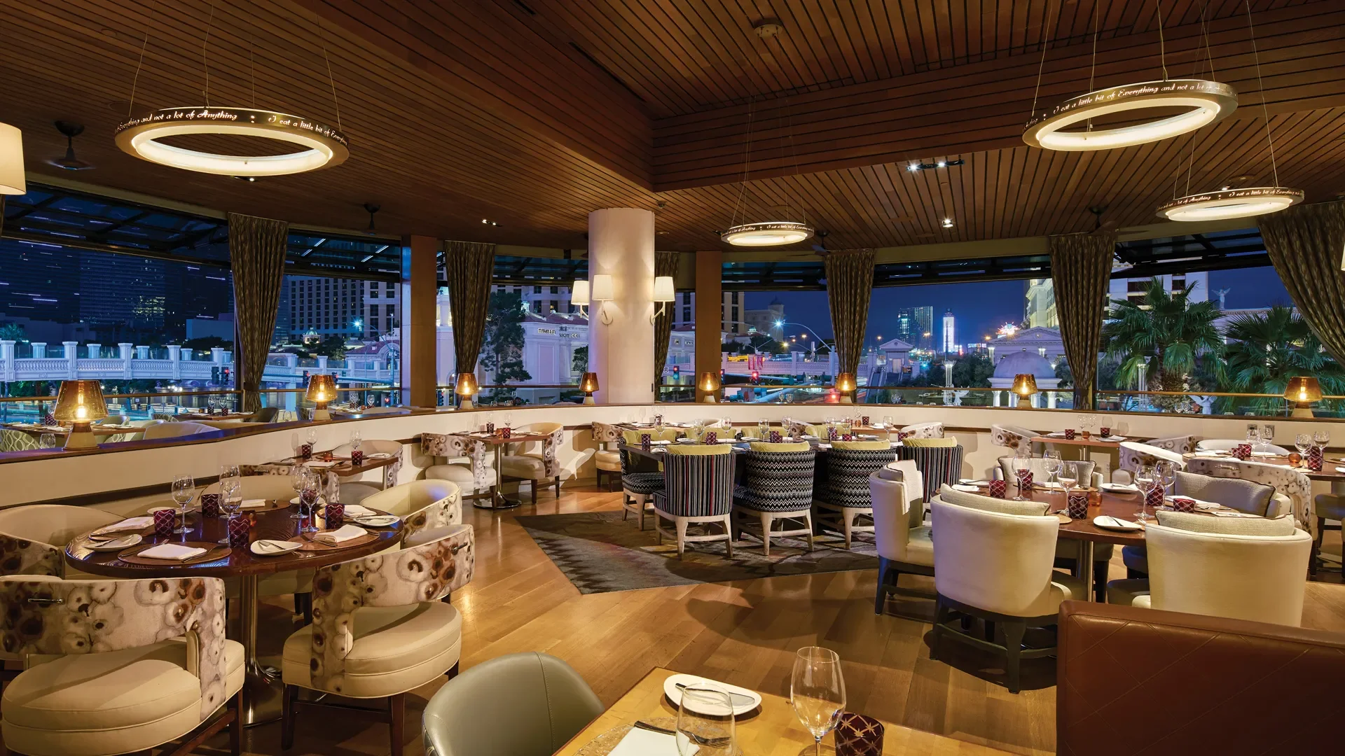 Giada dining room with floor-to-ceiling windows overlooking the Las Vegas Strip